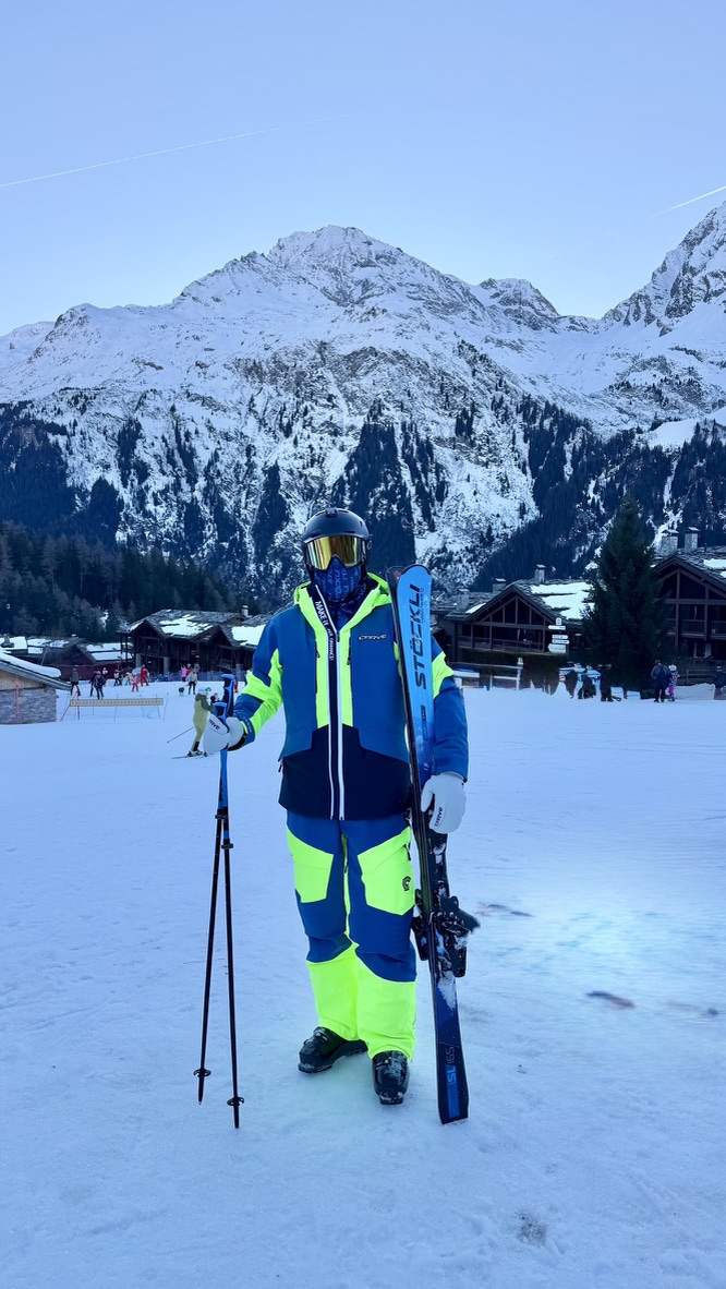 Adam on the mountain with his skiing equipment