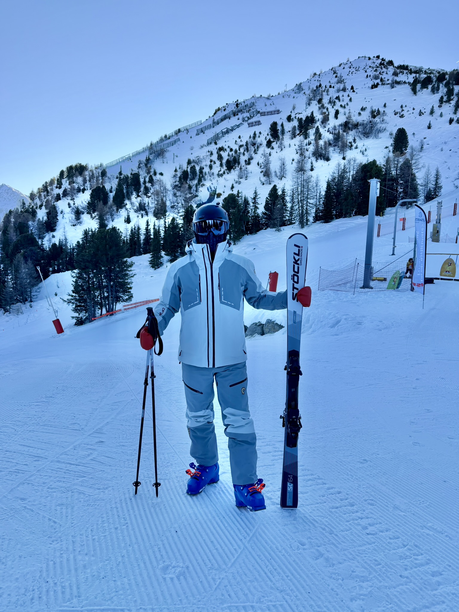 Adam on the mountain with his skiing equipment