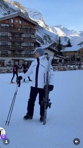 Adam in his white Toni Sailer jacket and black trousers in Val d’Isère
